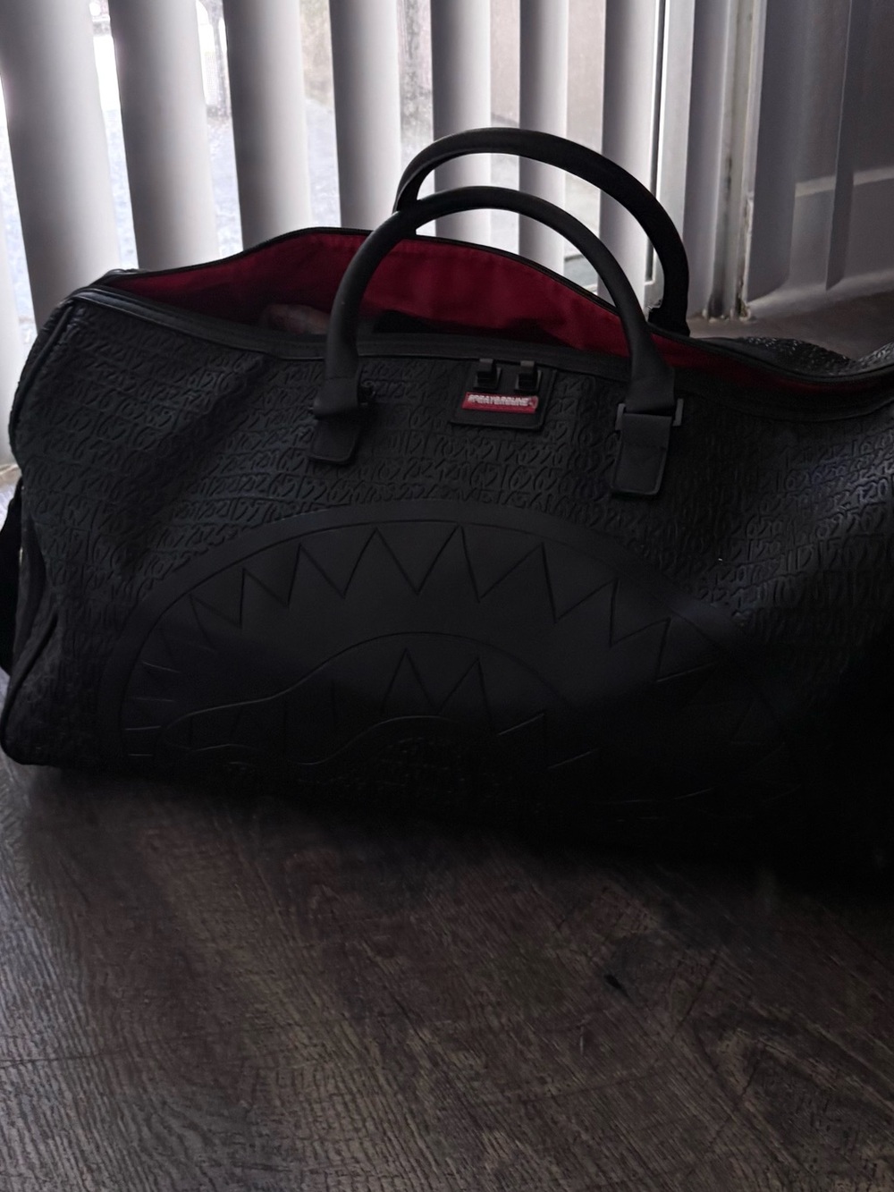 Sprayground Black Duffel Bag with Red Interior Accent